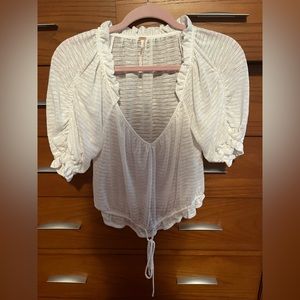 Brand: Free people Size: Small Style: White too with tie in front, bell sleeves